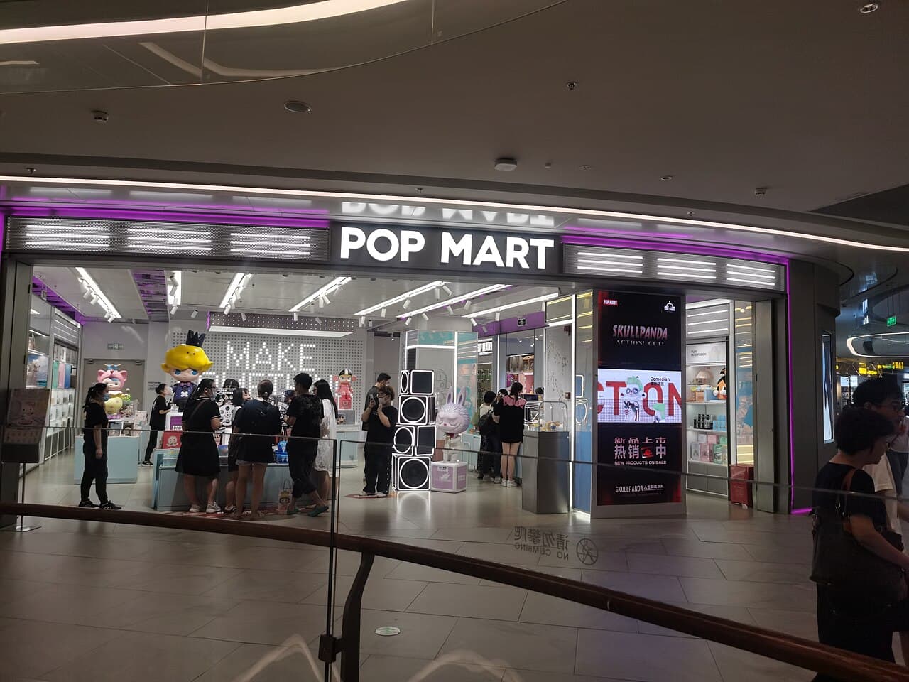Real photograph of a Pop Mart retail flagship store with designer art toys and blind boxes